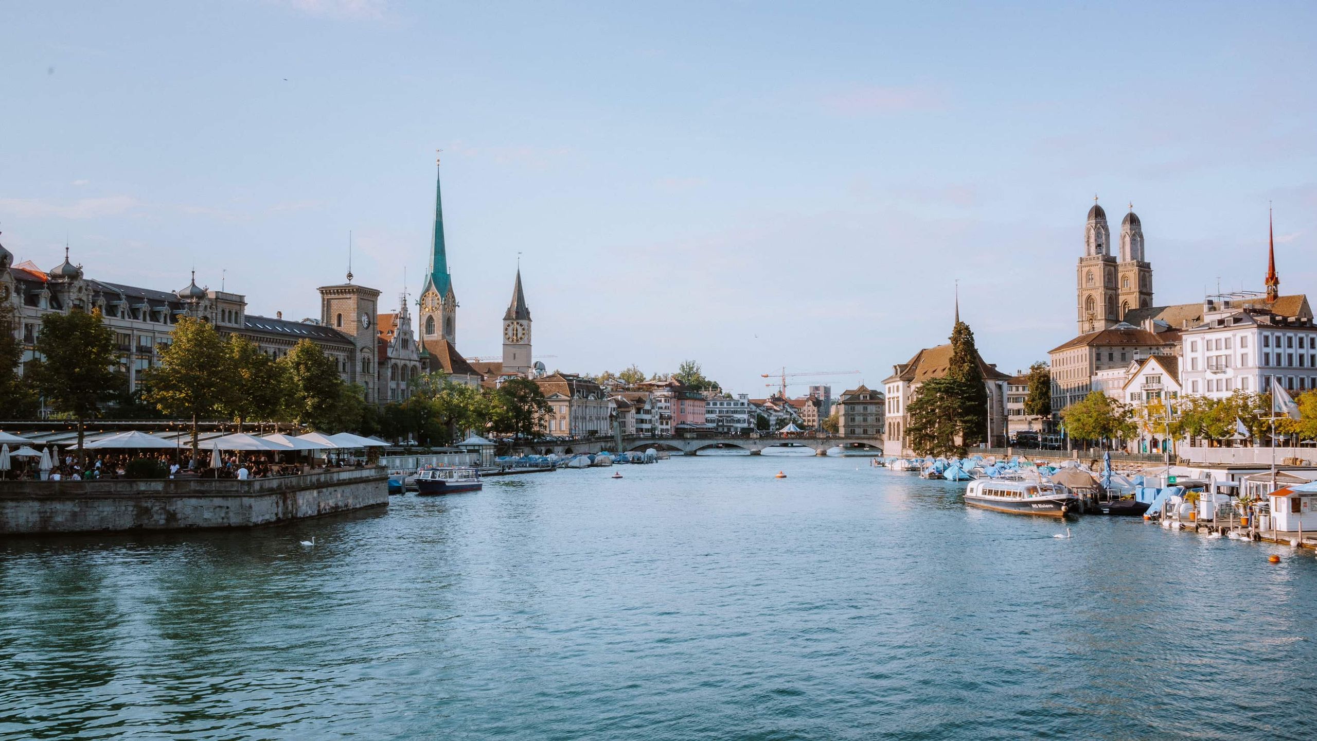 Explore the picturesque waterfront of Zürich with historical landmarks and serene waterways.